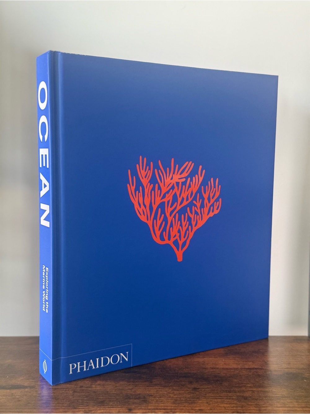 Phaidon Blue Hardcover with Red Coral Design
